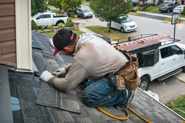 Professional Roofing technician working in Milroy, IN
